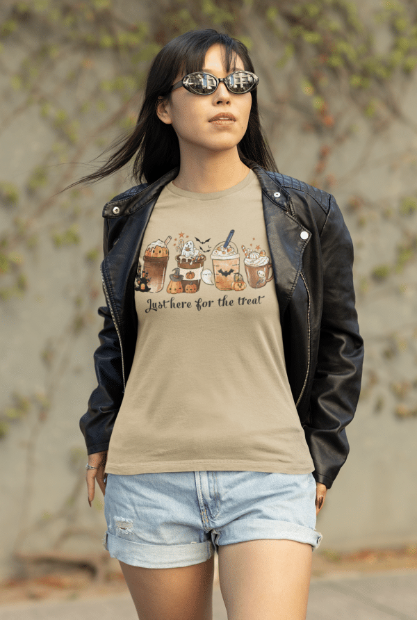 Cool Girl wearing a "Just here for the treat" shirt