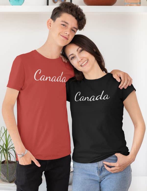 Canada Tshirt. Couple standing in red and black tshirts that have Canada written in a scripty font across the chest.